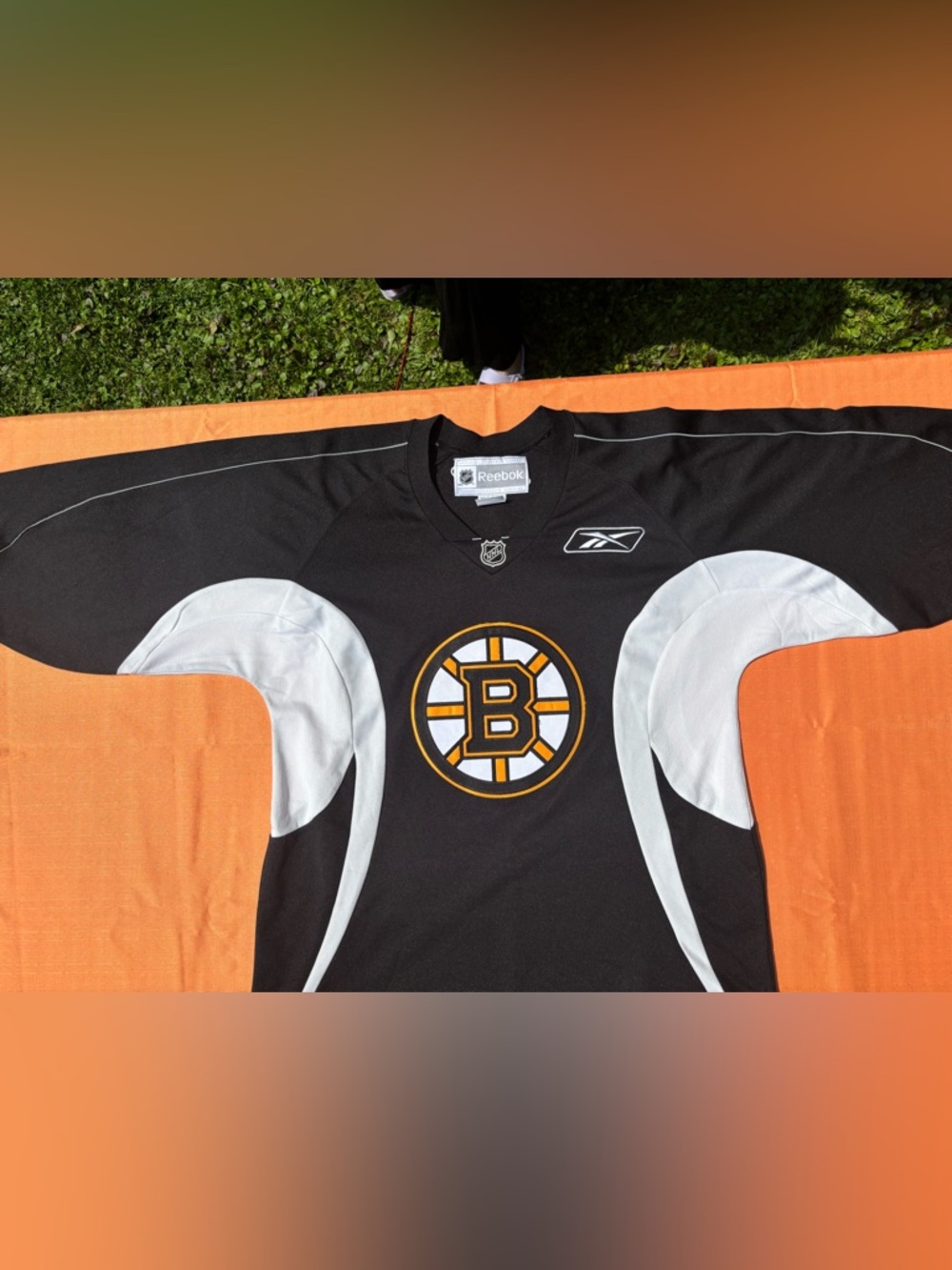 Reebok Black, White and Gold Boston practice Hockey Jersey